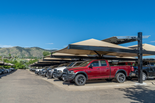 Solar-Integrated Hail Canopy providing hail protection for inventory and shade for customers at Christopher's Dodge Auto Dealership