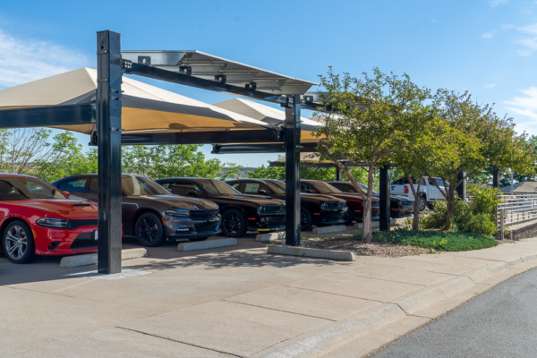 Solar-Integrated Hail Canopy providing hail protection for inventory and shade for customers at Christopher's Dodge Auto Dealership